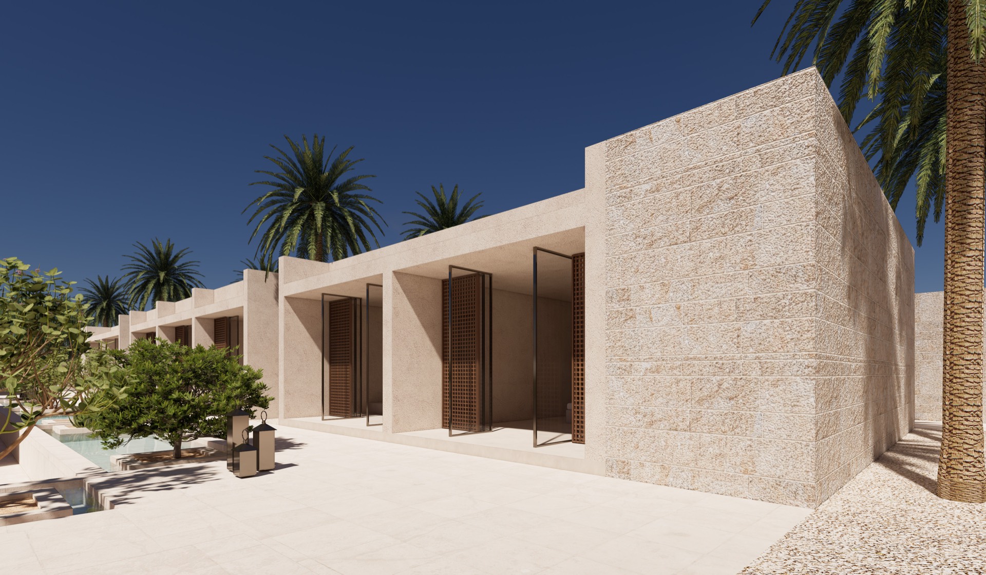 Textured stone guest volumes set among palms and native planting